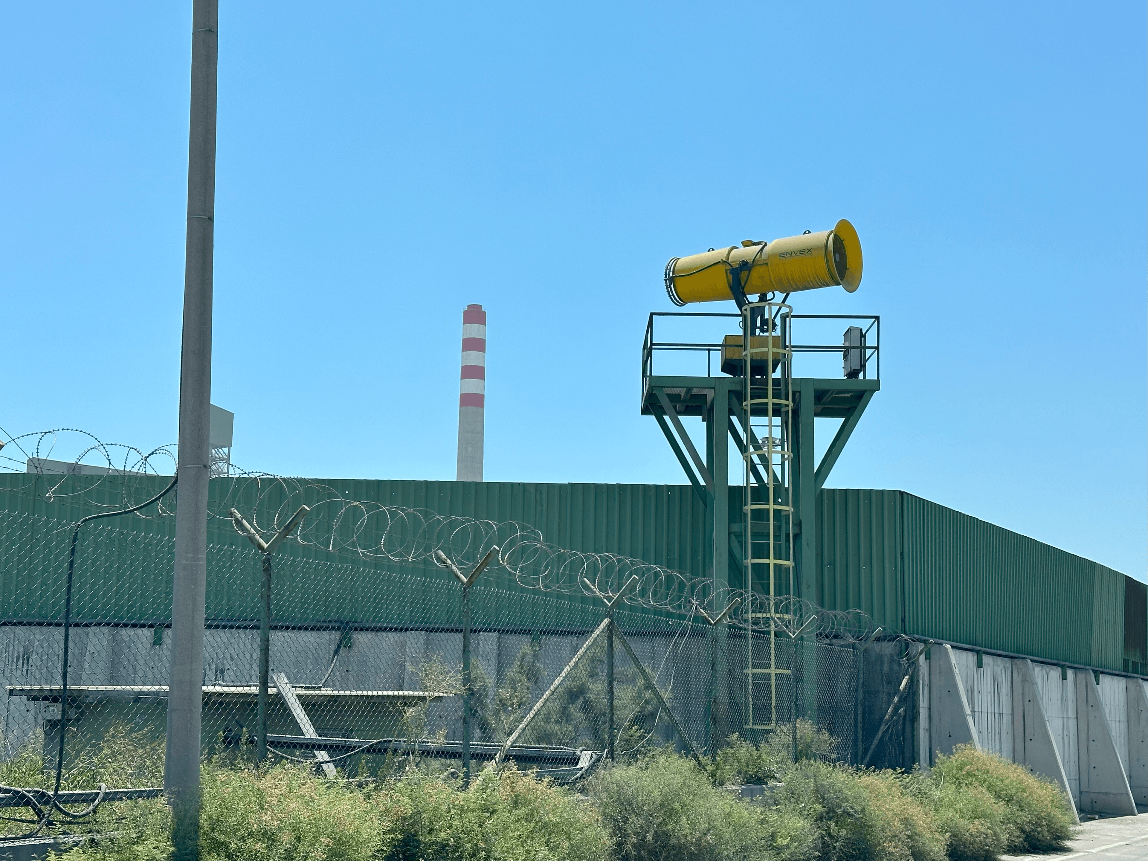 A powerful water mist from a dust cannon suppressing dust clouds at a mine.