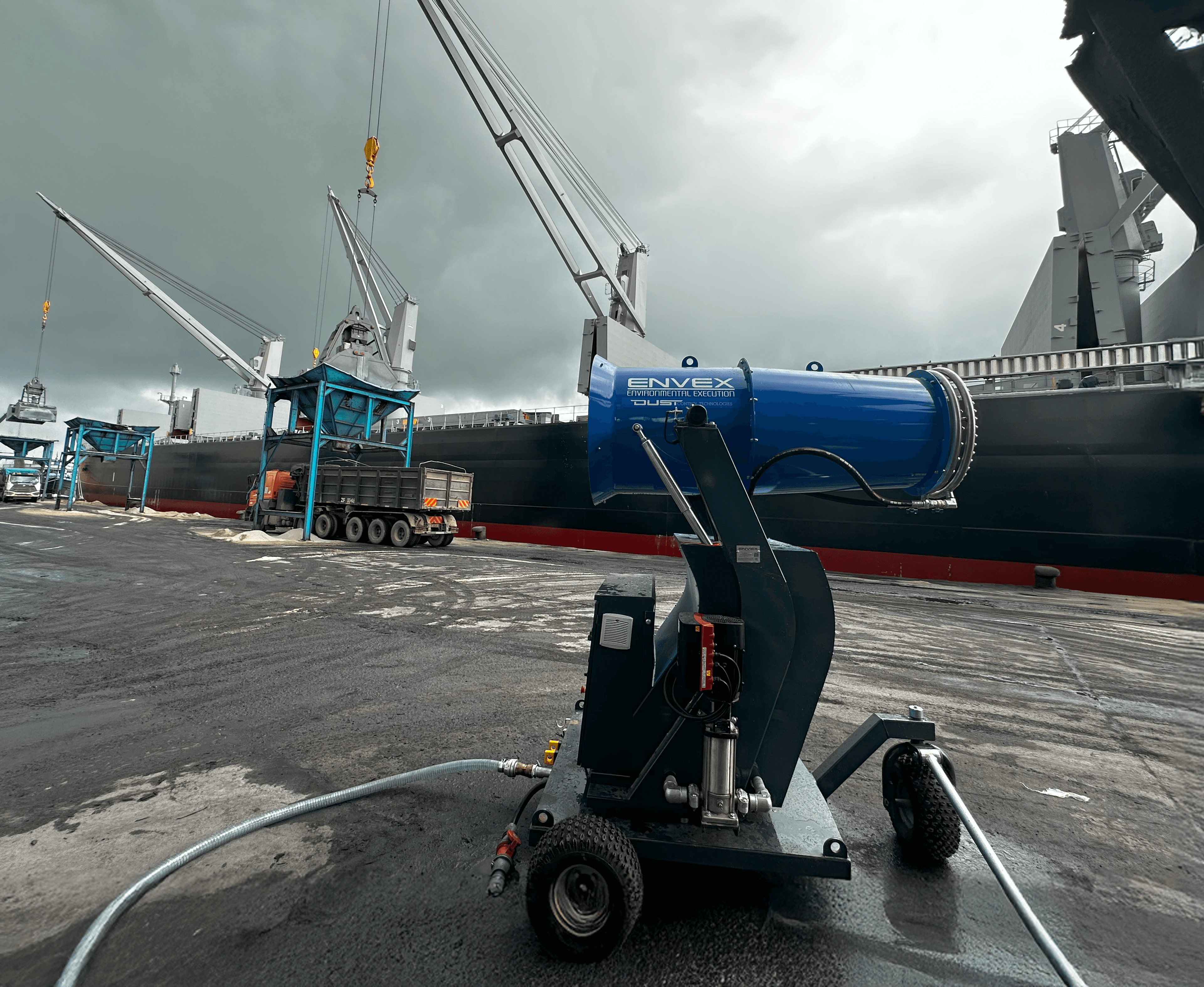 A yellow dust suppression cannon shown from the side.