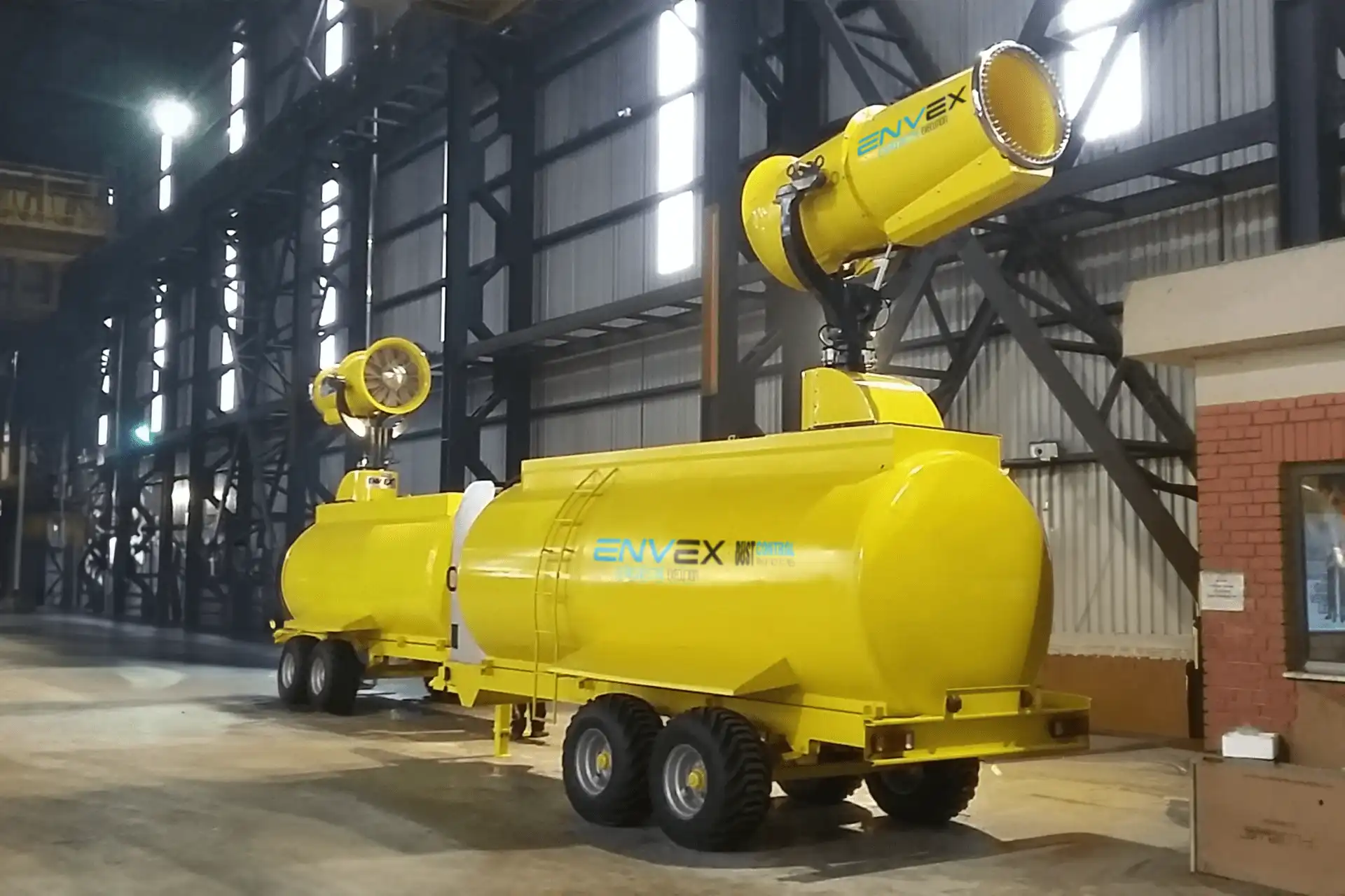 Trailer Mounted Fog Cannon with Water Tank A yellow, trailer-mounted fog cannon with an integrated water tank.